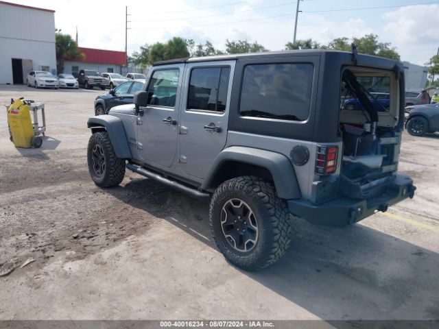 1C4BJWDG7EL100909 Jeep Wrangler Unlimited Sport