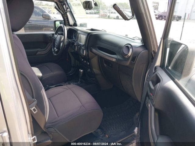 1C4BJWDG7EL100909 Jeep Wrangler Unlimited Sport