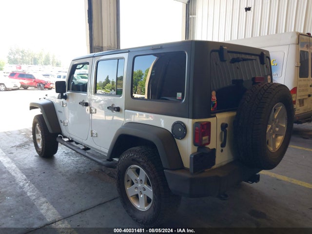 1C4BJWDG4EL250945 Jeep Wrangler Unlimited Sport