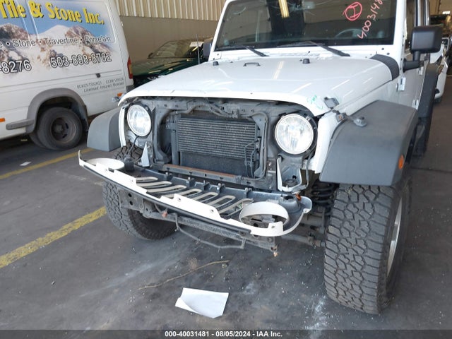 1C4BJWDG4EL250945 Jeep Wrangler Unlimited Sport