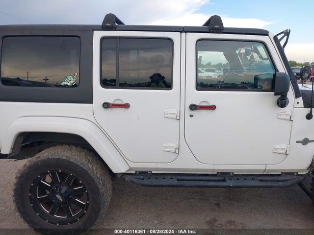 1C4BJWDG9EL161307 Jeep Wrangler Unlimited Freedom Edition