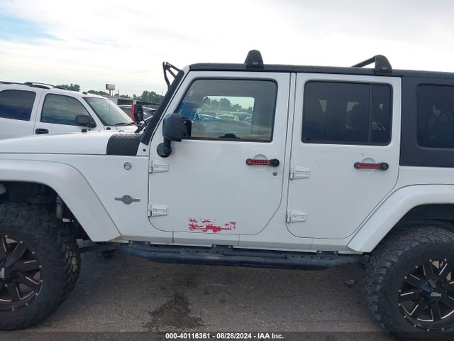 1C4BJWDG9EL161307 Jeep Wrangler Unlimited Freedom Edition