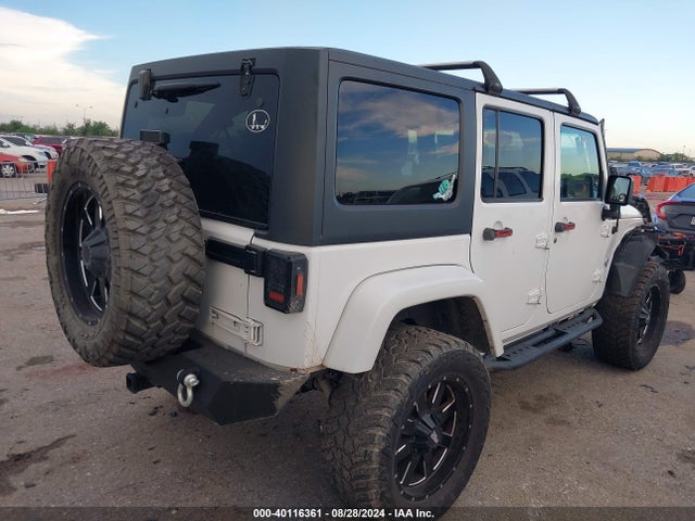 1C4BJWDG9EL161307 Jeep Wrangler Unlimited Freedom Edition