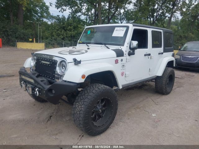 1C4BJWDG8EL307762 Jeep Wrangler Unlimited Sport