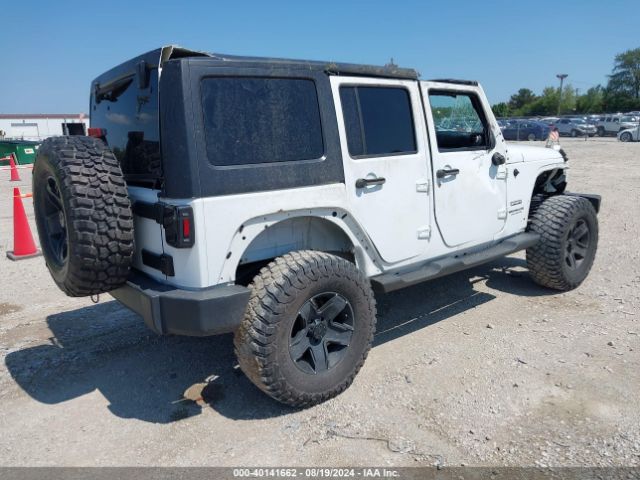 1C4BJWDG9EL269524 Jeep Wrangler Unlimited Sport