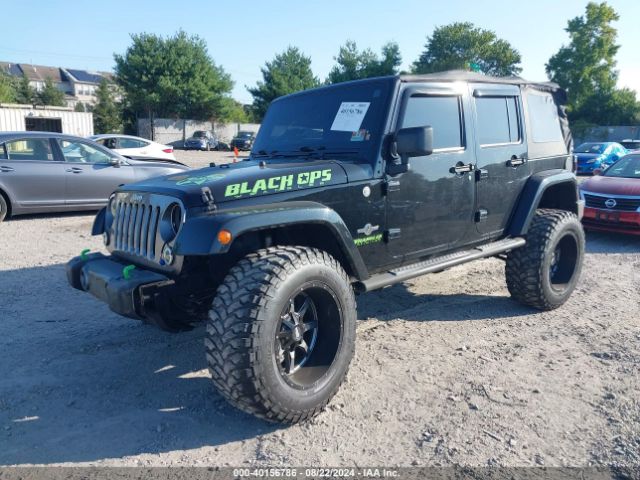 1C4BJWDG2EL235831 Jeep Wrangler Unlimited Freedom Edition