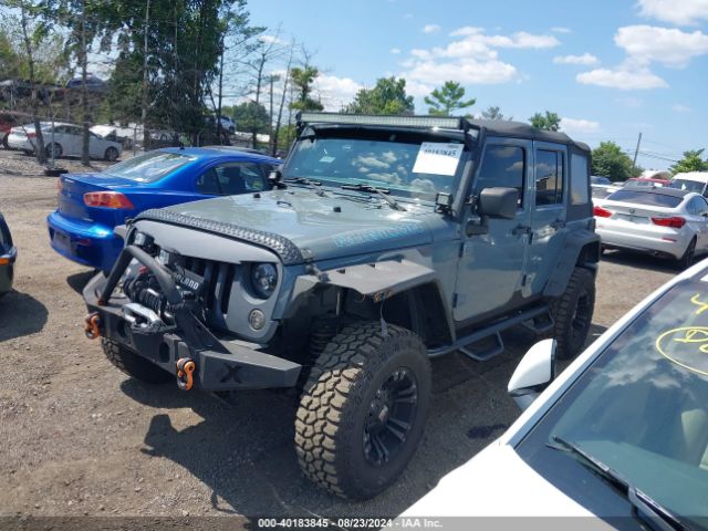 1C4BJWDG8EL129500 Jeep Wrangler Unlimited Sport