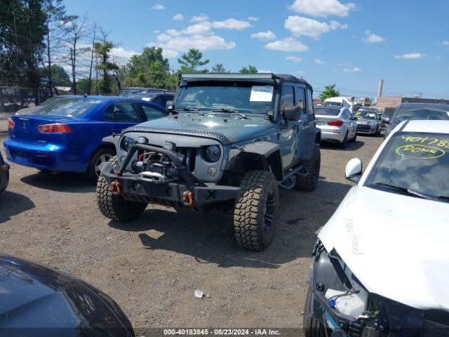 1C4BJWDG8EL129500 Jeep Wrangler Unlimited Sport