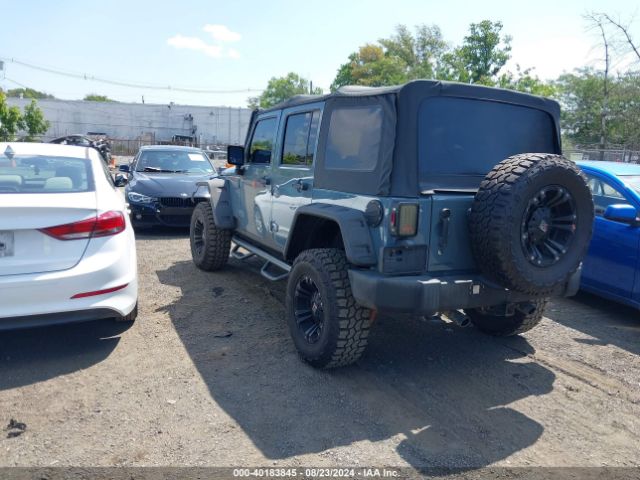 1C4BJWDG8EL129500 Jeep Wrangler Unlimited Sport