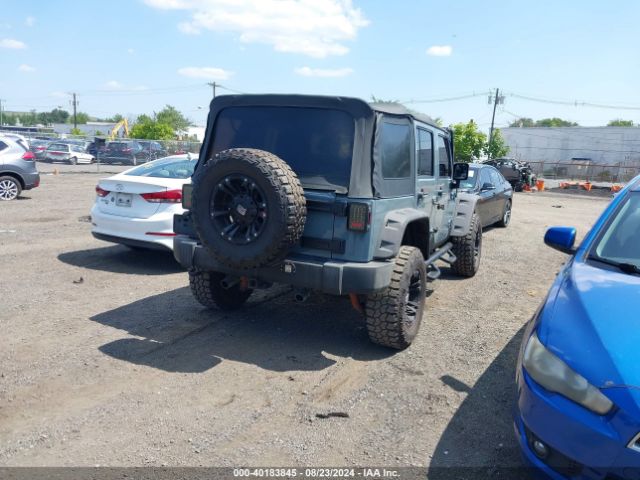 1C4BJWDG8EL129500 Jeep Wrangler Unlimited Sport