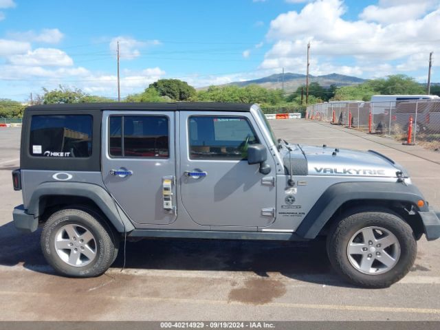 1C4HJWDG0EL227706 Jeep Wrangler Unlimited Sport