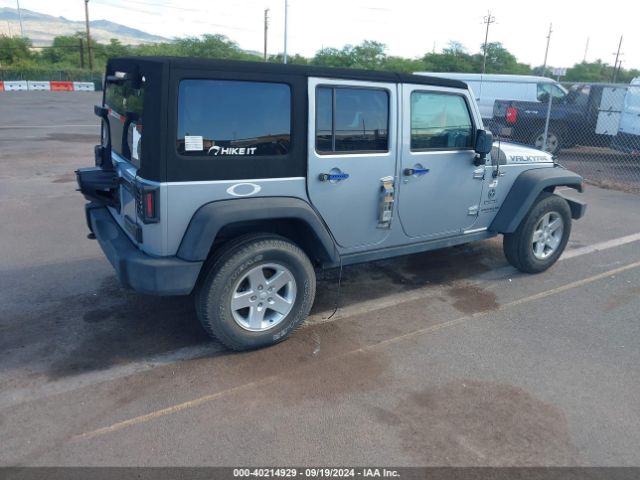 1C4HJWDG0EL227706 Jeep Wrangler Unlimited Sport