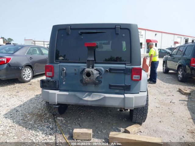 1C4BJWDG1EL305223 Jeep Wrangler Unlimited Sport