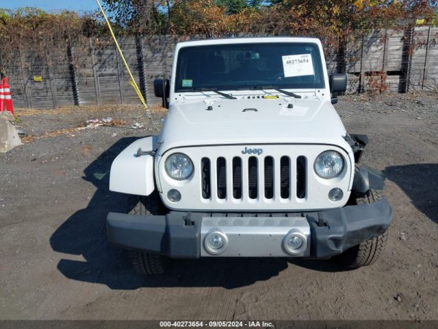 1C4AJWBG1EL258595 Jeep Wrangler Sahara