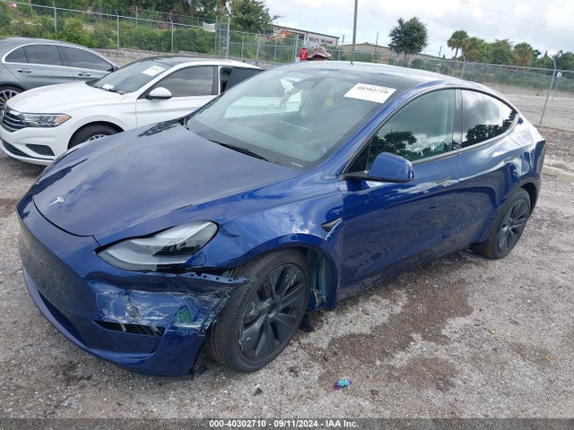 2024 TESLA MODEL Y 7SAYGDEE0RA320489 Photo 1