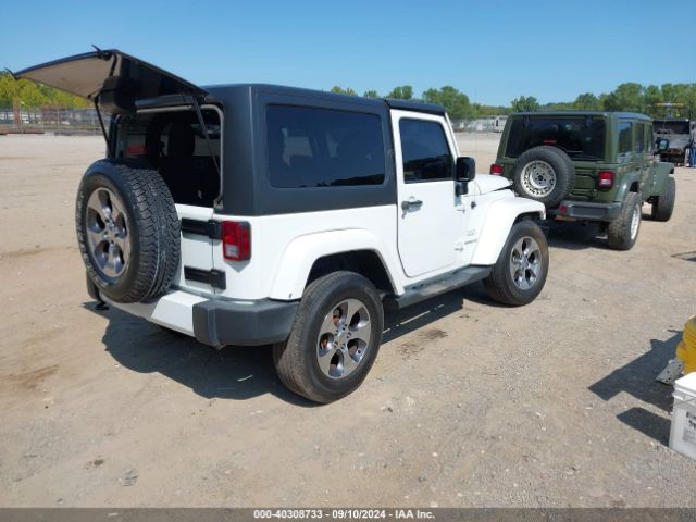 1C4AJWBG5GL128645 Jeep Wrangler Sahara