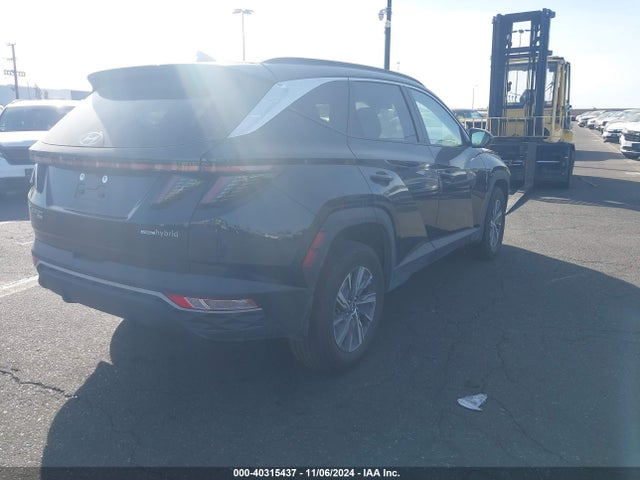 KM8JBCA10NU075896 Hyundai Tucson Hybrid Blue