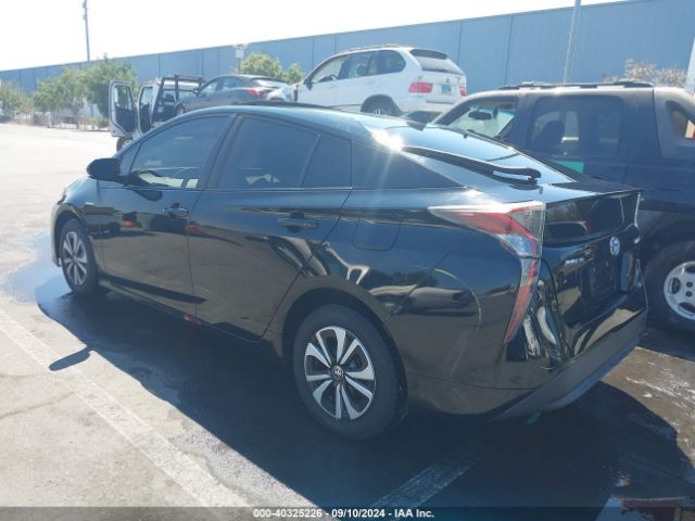 JTDKARFU0G3011335 Toyota Prius Four