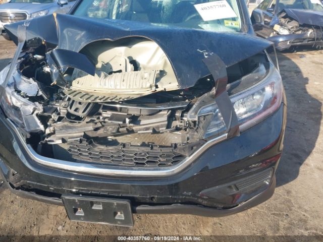 2HKRM4H34GH610305 Honda CR-V LX