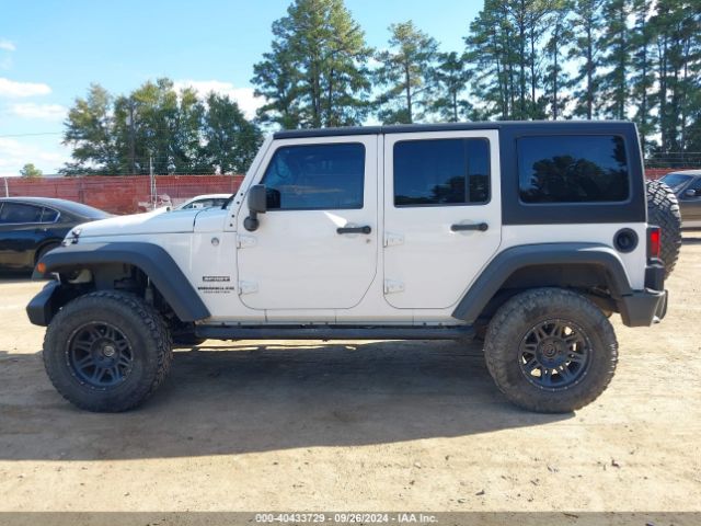 1C4HJWDG7EL134584 Jeep Wrangler Unlimited Sport