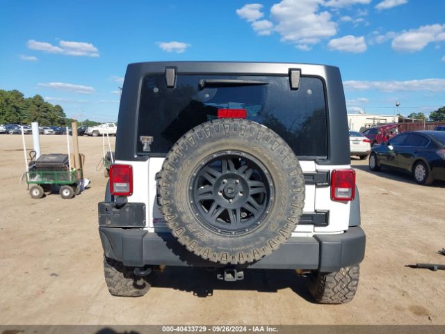 1C4HJWDG7EL134584 Jeep Wrangler Unlimited Sport