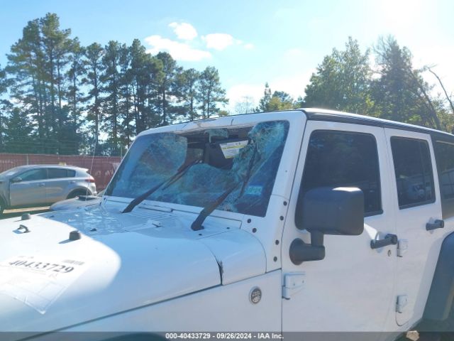 1C4HJWDG7EL134584 Jeep Wrangler Unlimited Sport