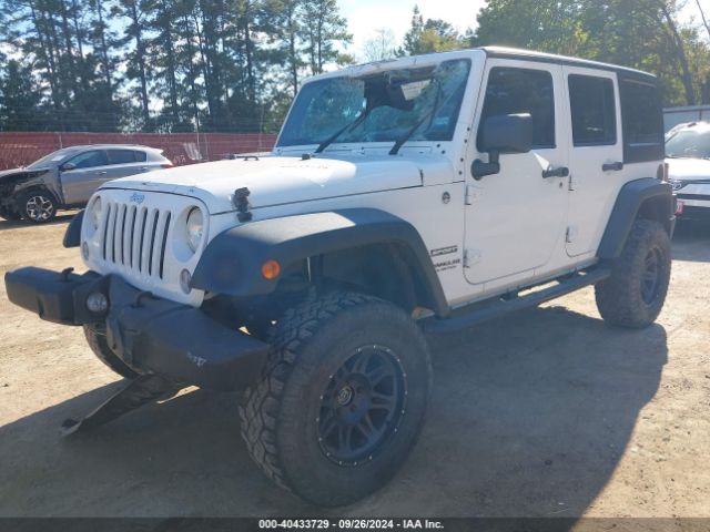 1C4HJWDG7EL134584 Jeep Wrangler Unlimited Sport