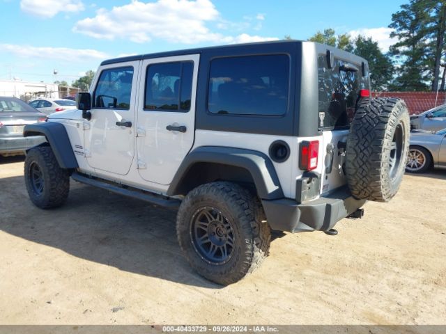 1C4HJWDG7EL134584 Jeep Wrangler Unlimited Sport