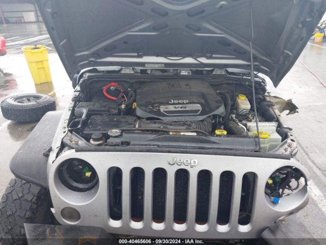 1C4BJWDG9EL141946 Jeep Wrangler Unlimited Sport
