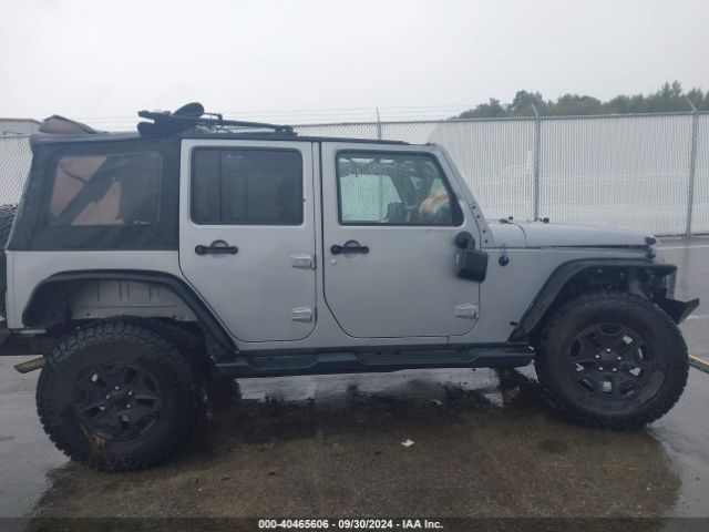 1C4BJWDG9EL141946 Jeep Wrangler Unlimited Sport