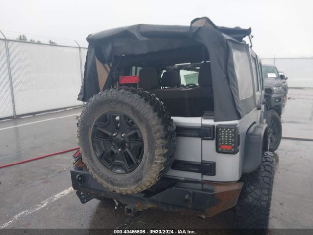 1C4BJWDG9EL141946 Jeep Wrangler Unlimited Sport