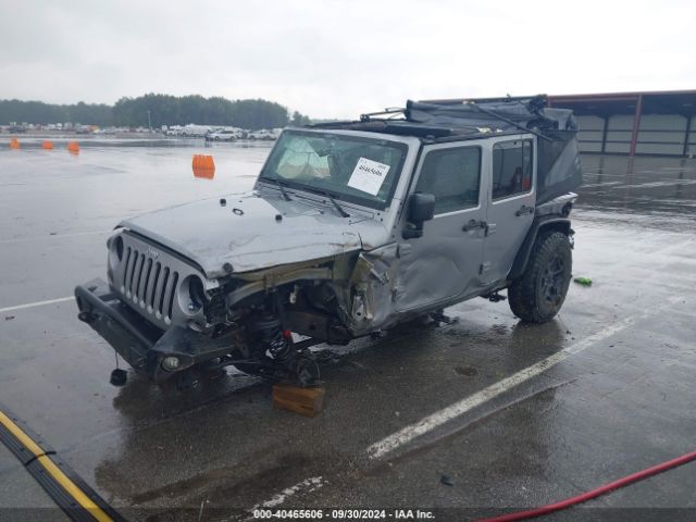 1C4BJWDG9EL141946 Jeep Wrangler Unlimited Sport