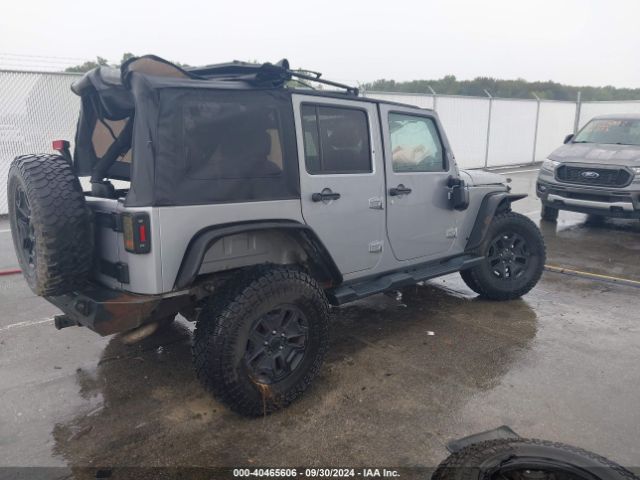 1C4BJWDG9EL141946 Jeep Wrangler Unlimited Sport