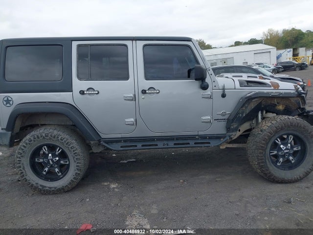 1C4HJWDG2EL199603 Jeep Wrangler Unlimited Freedom Edition