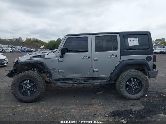 1C4HJWDG2EL199603 Jeep Wrangler Unlimited Freedom Edition