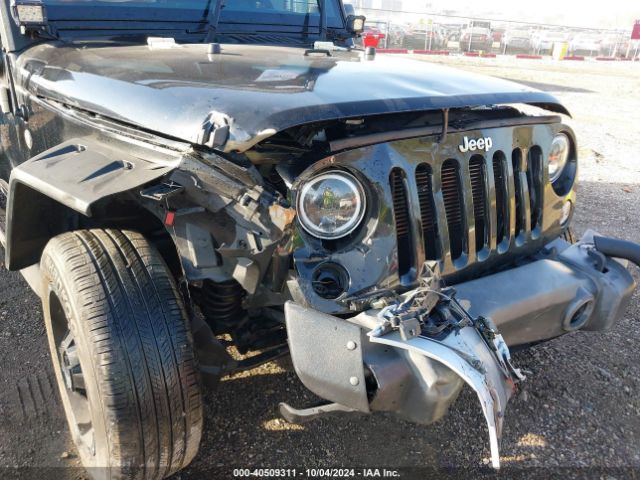 1C4AJWAG3GL334497 Jeep Wrangler Sport