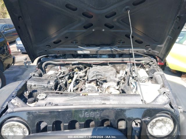 1C4BJWDG7EL300320 Jeep Wrangler Unlimited Sport