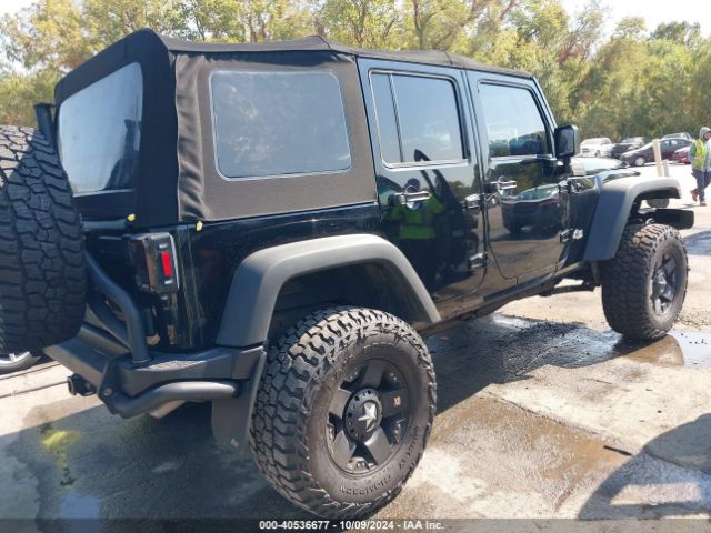 1C4BJWDG7EL300320 Jeep Wrangler Unlimited Sport
