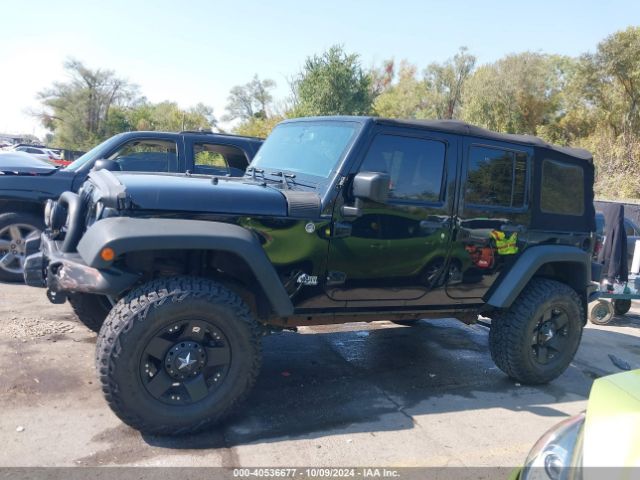 1C4BJWDG7EL300320 Jeep Wrangler Unlimited Sport