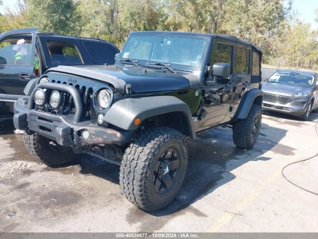 1C4BJWDG7EL300320 Jeep Wrangler Unlimited Sport