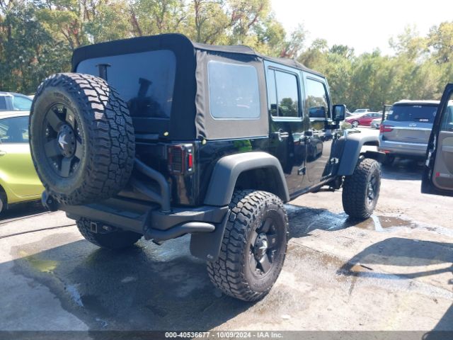 1C4BJWDG7EL300320 Jeep Wrangler Unlimited Sport