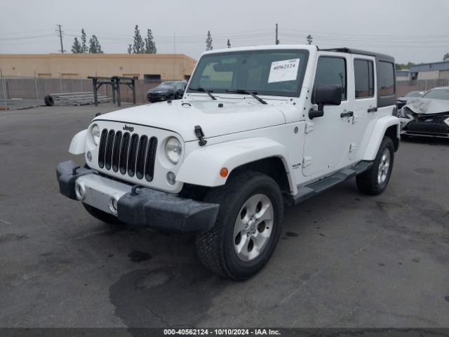 1C4BJWEG4EL322869 Jeep Wrangler Unlimited Sahara