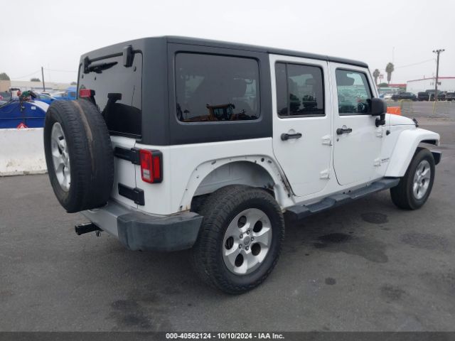 1C4BJWEG4EL322869 Jeep Wrangler Unlimited Sahara