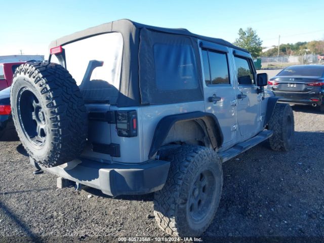 1C4BJWDG7EL320048 Jeep Wrangler Unlimited Sport