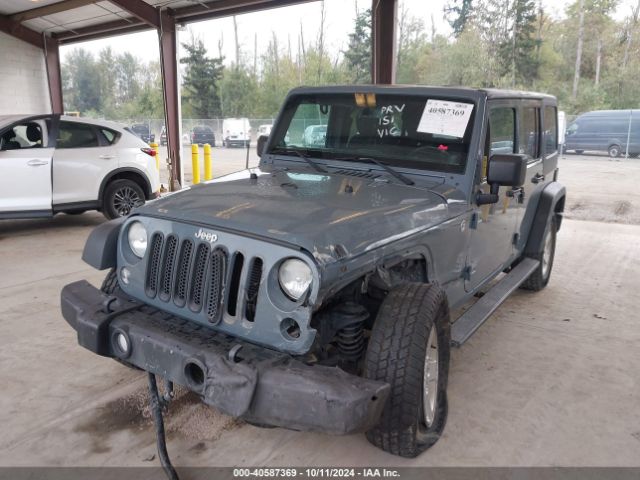 1C4HJWDG1EL227701 Jeep Wrangler Unlimited Sport
