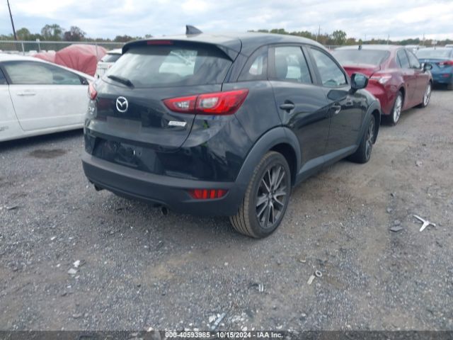 JM1DKFC72H0169584 Mazda Cx-3 Touring