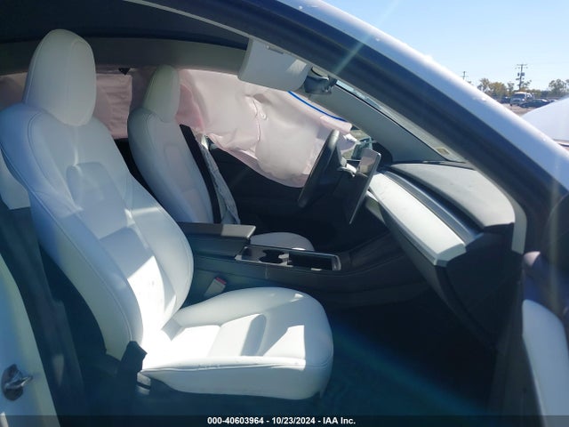 2023 TESLA MODEL Y 7SAYGDEE0PF697565 Photo 4