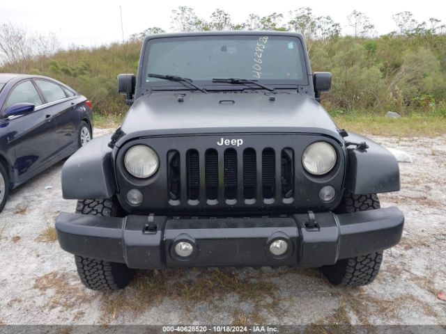 1C4BJWEG4EL317865 Jeep Wrangler Unlimited Sahara