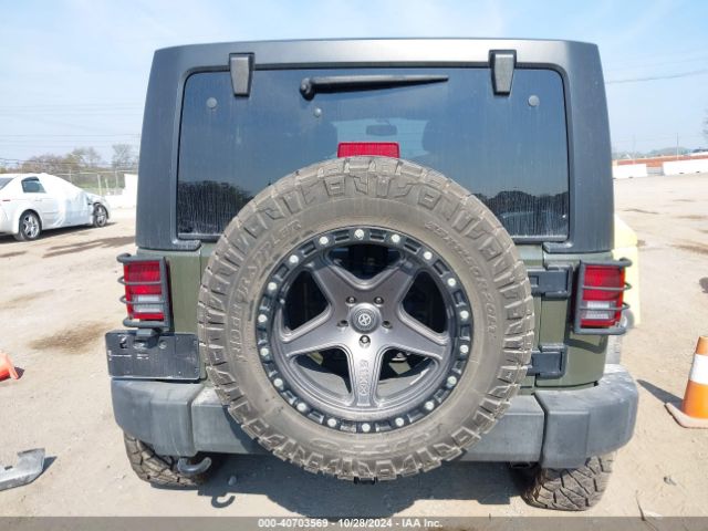 1C4BJWDG9FL599827 Jeep Wrangler Unlimited Sport