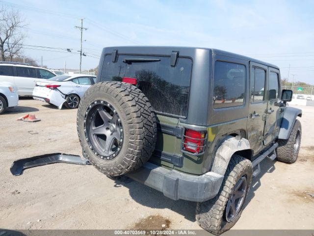 1C4BJWDG9FL599827 Jeep Wrangler Unlimited Sport
